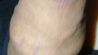 Grower slowly erects, no hands flaccid, foreskin with pre-cum drop at end.