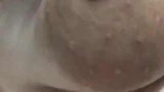 Milf plays with breasts