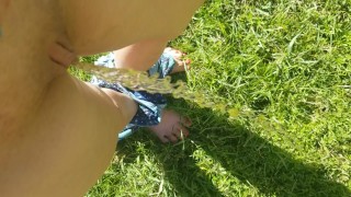 Quick Standing Summer Pee Outside In Grass
