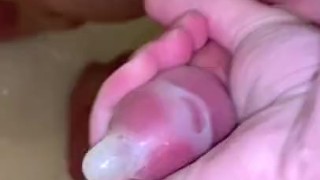 Filling up a condom in the shower