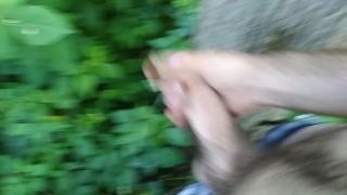 Gay boy pisses and jacks off on a tree