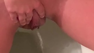 girl pissing and playing with her clit on toilet