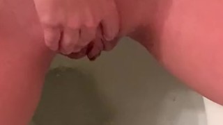 girl pissing and playing with her clit on toilet