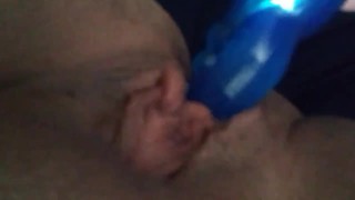 Masturbating using double headed vibrator