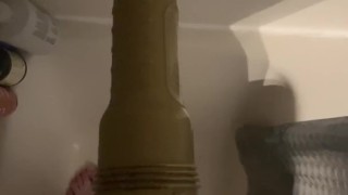 Fleshlight pussy in the shower sucking action with lots of lube