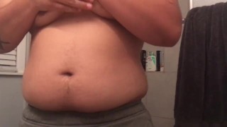 Chubby FTM plays with nipples rubs body and pussy