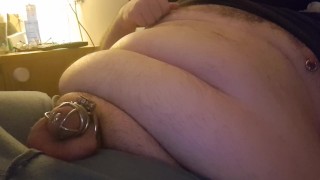 Chubby guy using his nipples to cum in chastity