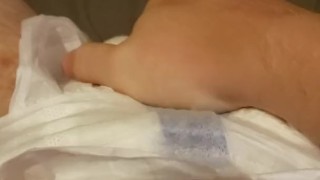 Playing with my freshly filled diaper