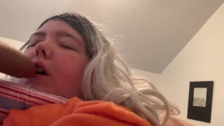 Sucking cock.