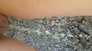 Desperation Pee Outside In River Rocks