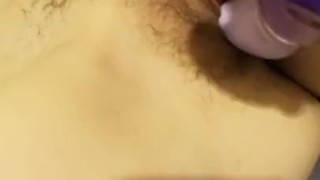 Girl teases herself with purple dildo
