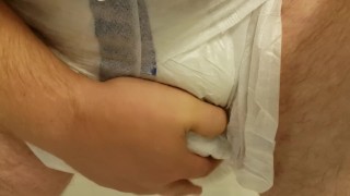 Playing with my diaper filled to the max