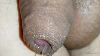 Tiny limp uncircumcised cock playing with precum, lots of foreskin, closeup