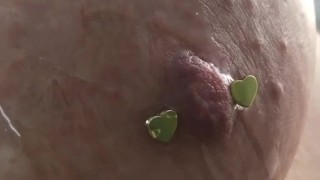 Dripping oil on my pierced tits