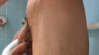 Tattooed daddy soaped up, fingering ass and shooting a monster load