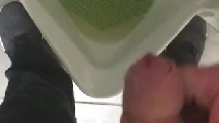 Pissing in a urinal in public at work