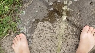 Babysitter Standing Pee Outside On Public Sidewalk