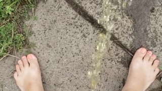 Babysitter Standing Pee Outside On Public Sidewalk