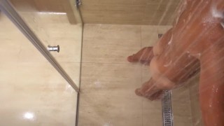 Twink takes a shower for his body and uncut cock