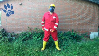 Worker Pup pawing off in red and yellow workgear