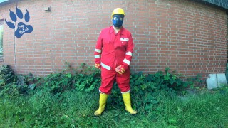 Worker Pup pawing off in red and yellow workgear