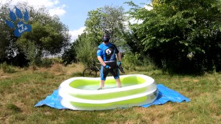 Cyclist pup in pool - cooling down and pawing off