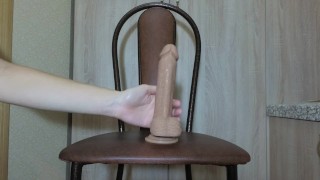 Cute ass gets fucked with a dildo on a chair