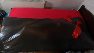 Rubberdoll get in Vacbed with gloves