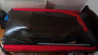 Rubberdoll get in Vacbed with gloves