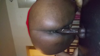 Ebony with juicy pussy riding dildo on table