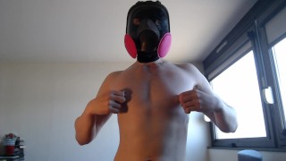 Smooth muscle twink playing with gas mask and ballstrecher
