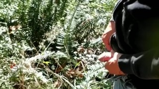 Guy pissing at a popular piss spot on the side of the highway.