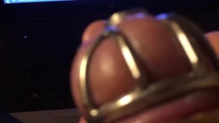 Watching Mistress Souzan squirt and squeezing balls while wearing cockcage