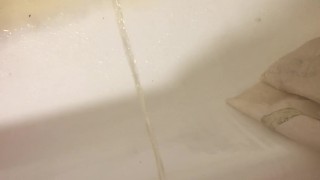 Russian guy pissing in the bath closeup