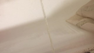 Russian guy pissing in the bath closeup