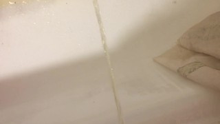 Russian guy pissing in the bath closeup