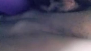 Fucking pussy with purple dildo
