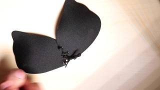 Cumshot on her black bra
