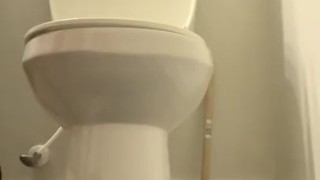Soldier jacking off on toilet