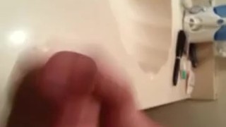 Amateur Latino stroking uncut cock for dripping cumshot in bathroom