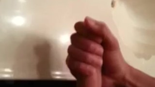 Amateur Latino stroking uncut cock for dripping cumshot in bathroom