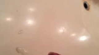Amateur Latino stroking uncut cock for dripping cumshot in bathroom