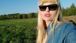 A sunny day & a gorgeous milf sunbathing in the field feeling sexy! 