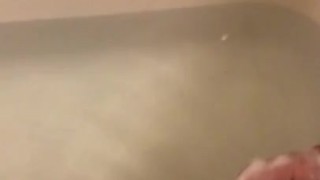 Stroking my soft cock in the bathtub with soap 