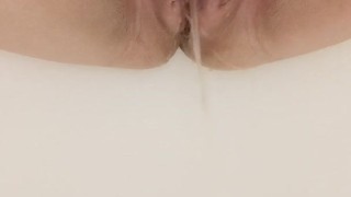 Horny pregnant milf pissing in the shower 