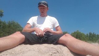 Risky pissing, jerking, and cumming on a public river bank