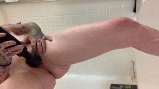 Wet and horny red head squirts in the shower
