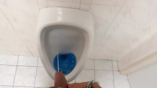Peeing and moaning after pee desperation at the public urinal