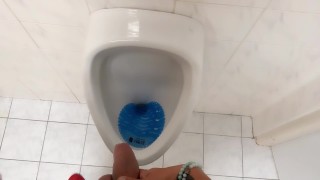 Peeing and moaning after pee desperation at the public urinal