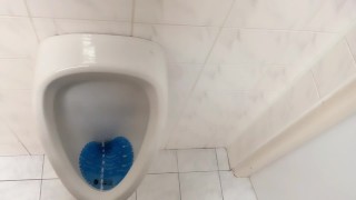 Peeing and moaning after pee desperation at the public urinal
